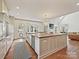 Bright kitchen with a center island with wooden counters, white cabinets, and stainless steel appliances at 2417 Calais Pl, Charlotte, NC 28211
