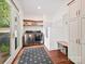 Mudroom with cabinets, floating shelves, tiled dog wash area, stainless steel washer and dryer at 2417 Calais Pl, Charlotte, NC 28211