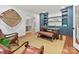 Bright office with blue built-in shelves, hardwood floors, and views of the dining room at 2417 Calais Pl, Charlotte, NC 28211
