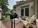 Relaxing brick patio with outdoor furniture, grill, and lush landscaping at 2417 Calais Pl, Charlotte, NC 28211