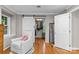 Comfortable sitting room with hardwood floors and entrance to walk-in closet at 2418 Ainsdale Rd, Charlotte, NC 28226