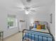 Cozy bedroom with a ceiling fan, a comfortable bed, and a sunny window at 2418 Ainsdale Rd, Charlotte, NC 28226