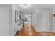 Spacious entryway with hardwood flooring, a chandelier, and a glimpse of the living room at 2418 Ainsdale Rd, Charlotte, NC 28226