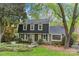 Charming two-story home featuring a landscaped front yard and classic architectural details at 2418 Ainsdale Rd, Charlotte, NC 28226