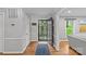 Inviting foyer with hardwood floors, offering a view of the landscaped front yard at 2418 Ainsdale Rd, Charlotte, NC 28226