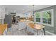 Open kitchen with stainless appliances, butcher block counters, dining area, and hardwood style flooring at 2418 Ainsdale Rd, Charlotte, NC 28226