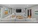 Bright living room featuring custom built-ins and a large comfortable sectional sofa at 2418 Ainsdale Rd, Charlotte, NC 28226