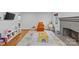 Cozy living room features a fireplace, wood floors, large windows, and neutral decor at 2418 Ainsdale Rd, Charlotte, NC 28226
