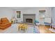 Inviting living room showcases a brick fireplace, hardwood floors, and natural light at 2418 Ainsdale Rd, Charlotte, NC 28226