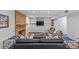 Cozy living room with a brick fireplace, built-in shelving, and comfortable seating at 2418 Ainsdale Rd, Charlotte, NC 28226