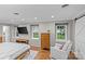 Main bedroom featuring hardwood floors, modern furniture and plenty of natural light at 2418 Ainsdale Rd, Charlotte, NC 28226