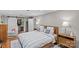 Spacious bedroom with hardwood floors, barn door closet and white linens at 2418 Ainsdale Rd, Charlotte, NC 28226