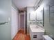 Functional bathroom features a single sink vanity, a toilet, and storage with neutral paint at 2900 #G Heathstead Pl, Charlotte, NC 28210