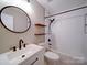 Modern bathroom featuring a white vanity, updated fixtures, and a tub-shower combo at 2900 #G Heathstead Pl, Charlotte, NC 28210