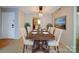 Formal dining room with seating for six, decorative lighting and art at 2900 #G Heathstead Pl, Charlotte, NC 28210