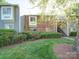 Well-maintained exterior view of a multi-Gathering home with lush greenery and inviting landscaping at 2900 #G Heathstead Pl, Charlotte, NC 28210