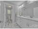 A bathroom featuring a double vanity, a toilet and a shower with modern fixtures at 3075 Jamestown Dr, Gastonia, NC 28054