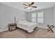 This bedroom has a white comforter, carpet and natural lighting at 3075 Jamestown Dr, Gastonia, NC 28054