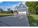 Charming two-story home with a spacious driveway leading to a two-car garage and inviting front porch at 3075 Jamestown Dr, Gastonia, NC 28054