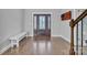 Inviting foyer featuring hardwood floors, a bench, and a decorative glass front door at 3075 Jamestown Dr, Gastonia, NC 28054