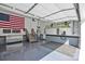 Spacious garage with epoxy floors, ample storage, and an American flag, showcasing functionality and patriotism at 3075 Jamestown Dr, Gastonia, NC 28054