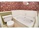 Bathroom features a bathtub with floral wallpaper, creating a relaxing and uniquely styled space at 317 Port Royal Dr, Matthews, NC 28105