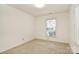 Bright bedroom with a window, neutral carpet, and fresh paint, offering a blank canvas for personalization at 317 Port Royal Dr, Matthews, NC 28105