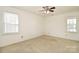 Bright bedroom with ample natural light from two large windows at 317 Port Royal Dr, Matthews, NC 28105