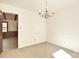 Dining room with chandelier and doorway to additional living space at 317 Port Royal Dr, Matthews, NC 28105