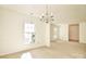 Bright dining room with ample natural light and classic chandelier at 317 Port Royal Dr, Matthews, NC 28105