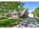 Beautiful brick home featuring a detached garage and well-kept lawn at 317 Port Royal Dr, Matthews, NC 28105
