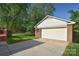 Detached garage with a double door and brick facade at 317 Port Royal Dr, Matthews, NC 28105