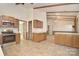 Spacious kitchen with tile floor, eat-in bar, and wooden beams at 317 Port Royal Dr, Matthews, NC 28105