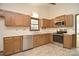 Charming kitchen featuring stainless steel appliances and wood cabinetry at 317 Port Royal Dr, Matthews, NC 28105