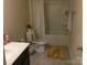 Bathroom featuring tub and shower, white vanity, and neutral walls at 3173 Pinehills Way, Mount Holly, NC 28120