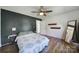 Cozy bedroom features a ceiling fan, painted accent wall, and a light-filled interior with wood-look flooring at 3270 Kings Row Dr, Rock Hill, SC 29732