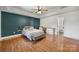 Spacious bedroom with a modern ceiling fan, walk-in closet, and ample natural light at 3270 Kings Row Dr, Rock Hill, SC 29732