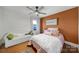 Comfortable bedroom with orange accent wall, ceiling fan, and natural light at 3270 Kings Row Dr, Rock Hill, SC 29732