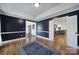 Dining room with dark blue walls, natural light, and hardwood floors at 3270 Kings Row Dr, Rock Hill, SC 29732