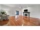 Spacious living room with hardwood floors, fireplace, and doors leading to the foyer at 3270 Kings Row Dr, Rock Hill, SC 29732