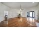 Open-concept living room with hardwood floors and multiple doorways to adjacent rooms at 3270 Kings Row Dr, Rock Hill, SC 29732