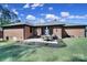 Outdoor patio space with table, chairs, grill, and well-manicured landscaping make this backyard inviting at 3270 Kings Row Dr, Rock Hill, SC 29732
