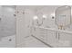 Bathroom featuring double vanities with gold hardware and a large shower area at 3300 Sharon Rd, Charlotte, NC 28211