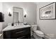 Modern bathroom featuring a black vanity, with sleek fixtures, and sophisticated lighting for a luxurious feel at 3300 Sharon Rd, Charlotte, NC 28211