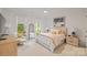 Bright bedroom featuring natural light, complemented by stylish decor and a comfortable seating area at 3300 Sharon Rd, Charlotte, NC 28211