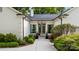Elegant front entrance with manicured landscaping, a concrete walkway, and a sophisticated entry at 3300 Sharon Rd, Charlotte, NC 28211
