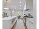 Modern kitchen with stainless steel appliances, center island, and bright lighting at 3300 Sharon Rd, Charlotte, NC 28211