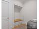Mudroom area with a built-in bench, hooks, and storage at 3300 Sharon Rd, Charlotte, NC 28211