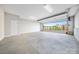 Spacious three-car garage with clean concrete floor and bright lighting and plenty of room for storage at 360 N Broad St, Waxhaw, NC 28173