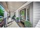 Cozy front porch with chairs and a welcoming door and decor for relaxing at 360 N Broad St, Waxhaw, NC 28173